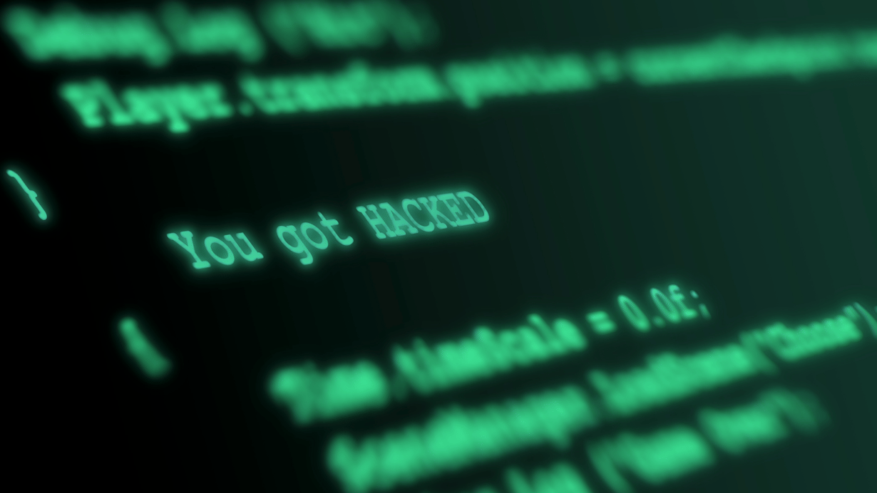 Computerscherm vol code met de tekst you got hacked